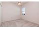 Cozy bedroom with neutral carpet, a ceiling fan, and a window allowing natural light at 711 Planters Manor Way, Bradenton, FL 34212