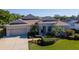 Charming single-story home featuring a well-manicured lawn and two-car garage at 711 Planters Manor Way, Bradenton, FL 34212