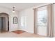 Bright foyer with a decorative window and convenient access to other rooms at 711 Planters Manor Way, Bradenton, FL 34212