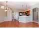 Spacious and bright living room adjoins kitchen for easy entertaining at 711 Planters Manor Way, Bradenton, FL 34212
