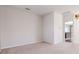 Bright living room with neutral walls and plush carpet, leading to other areas of the home at 711 Planters Manor Way, Bradenton, FL 34212