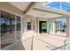 Covered pool patio featuring sliding glass doors, recessed lighting and ceiling fan at 711 Planters Manor Way, Bradenton, FL 34212
