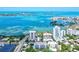 Stunning aerial view showcasing waterfront condos with city and ocean views at 755 S Palm Avenue # 604, Sarasota, FL 34236