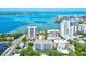 Stunning aerial view of waterfront condos with bay views and boat dotted harbor at 755 S Palm Avenue # 604, Sarasota, FL 34236