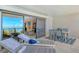 Condo balcony with chairs, a table setting, and expansive views of the bay at 755 S Palm Avenue # 604, Sarasota, FL 34236