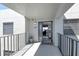 Condo balcony with secure fence and a view, overlooking the entryway and living room at 755 S Palm Avenue # 604, Sarasota, FL 34236