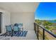 Charming balcony with dining set provides a relaxing space to enjoy beautiful bay views at 755 S Palm Avenue # 604, Sarasota, FL 34236