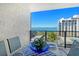 Inviting balcony space with outdoor dining area and scenic bay view with boats at 755 S Palm Avenue # 604, Sarasota, FL 34236