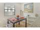Bright dining area features large window, water view, and modern decor at 755 S Palm Avenue # 604, Sarasota, FL 34236
