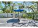 Community grilling area with tables and grills available for resident use at 755 S Palm Avenue # 604, Sarasota, FL 34236