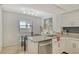 Bright kitchen features granite counters, stainless appliances, and view at 755 S Palm Avenue # 604, Sarasota, FL 34236