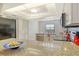 Bright kitchen features granite counters, stainless appliances, and modern lighting at 755 S Palm Avenue # 604, Sarasota, FL 34236