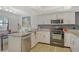 Bright kitchen with stainless appliances, granite counters, and modern cabinetry at 755 S Palm Avenue # 604, Sarasota, FL 34236