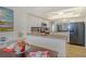 Open concept kitchen has granite counters, stainless appliances, and seating at 755 S Palm Avenue # 604, Sarasota, FL 34236