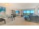 Open-concept living room with water views and a dining area perfect for entertaining guests at 755 S Palm Avenue # 604, Sarasota, FL 34236