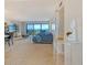 Bright living room featuring expansive water views, comfortable seating, and stylish decor at 755 S Palm Avenue # 604, Sarasota, FL 34236