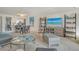 Open-concept living area featuring stylish decor, a dining area, and a view into the modern kitchen at 755 S Palm Avenue # 604, Sarasota, FL 34236