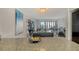 A spacious, modern, open-plan kitchen and living area featuring water views and stylish furnishings at 755 S Palm Avenue # 604, Sarasota, FL 34236
