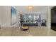 A spacious, modern, open-plan kitchen and living area featuring water views and stylish furnishings at 755 S Palm Avenue # 604, Sarasota, FL 34236