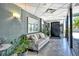 Relaxing lobby features a comfortable couch, tiled floor, and wall art at 755 S Palm Avenue # 604, Sarasota, FL 34236
