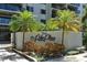 Palm Place building sign surrounded by manicured landscaping at 755 S Palm Avenue # 604, Sarasota, FL 34236