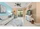 Bright living area featuring stylish furniture, coastal decor, and sliding glass doors to a patio at 7783 Limestone Ln # 10-101, Sarasota, FL 34233