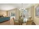 Dining room with pool view and a glass table at 7847 Chick Evans Pl, Sarasota, FL 34240