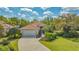 Well maintained property showing driveway, landscape, and roof at 7847 Chick Evans Pl, Sarasota, FL 34240