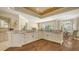 Kitchen features granite countertops, stainless appliances, and seamlessly flows into dining area at 7847 Chick Evans Pl, Sarasota, FL 34240