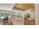 Spacious kitchen features granite countertops, stainless appliances, and a wood plank ceiling detail at 7847 Chick Evans Pl, Sarasota, FL 34240