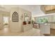 Bright open floorplan showing a wine rack and access to the living room at 7847 Chick Evans Pl, Sarasota, FL 34240