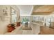Open-concept space connects to outdoor area with a full wine rack at 7847 Chick Evans Pl, Sarasota, FL 34240