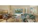 Cozy living room with fireplace and pool view through sliding glass doors at 7847 Chick Evans Pl, Sarasota, FL 34240
