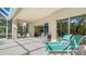 Inviting covered patio featuring lounge chairs and seamless indoor-outdoor living at 7847 Chick Evans Pl, Sarasota, FL 34240