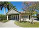 Charming pool house with shaded seating, offering a relaxing community gathering place at 7847 Chick Evans Pl, Sarasota, FL 34240