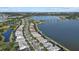 Aerial view of community with lakefront property at 8016 Grande Shores Dr, Sarasota, FL 34240