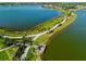Stunning aerial view of the lake and walking trails in this beautiful community at 8016 Grande Shores Dr, Sarasota, FL 34240