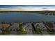 An aerial view of the home, showcasing the lake view and the surrounding community at 8016 Grande Shores Dr, Sarasota, FL 34240