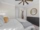Bedroom featuring recessed lights, neutral decor, and modern dark wood dresser at 8016 Grande Shores Dr, Sarasota, FL 34240