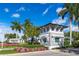 The Shoreview at Waterside entrance sign is surrounded by colorful landscaping and mature palm trees at 8016 Grande Shores Dr, Sarasota, FL 34240