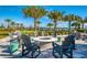 Outdoor fire pit with seating, perfect for relaxing and enjoying the community's outdoor space at 8016 Grande Shores Dr, Sarasota, FL 34240