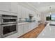 Well-equipped kitchen featuring stainless steel appliances, subway tile backsplash, and a view to the dining area at 8016 Grande Shores Dr, Sarasota, FL 34240