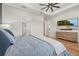 Comfortable bedroom with a tray ceiling and TV, offering a relaxing retreat at 8016 Grande Shores Dr, Sarasota, FL 34240