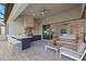 Inviting outdoor kitchen and patio space with built-in grill and outdoor seating at 8016 Grande Shores Dr, Sarasota, FL 34240