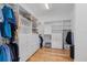 Custom designed closet with ample storage and shelving for shoes, clothing, and accessories at 8016 Grande Shores Dr, Sarasota, FL 34240