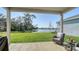 Enjoy peaceful lake views from this backyard patio with cozy seating during the day at 8918 Waxwing Way, Parrish, FL 34219