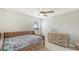 Cozy bedroom with comfortable seating, a plush bed, and a stylish dresser, offering a relaxing and inviting space at 8918 Waxwing Way, Parrish, FL 34219