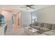 Bright upstairs bonus room with a comfortable sectional sofa and natural light that makes it feel inviting at 8918 Waxwing Way, Parrish, FL 34219