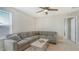 Upstairs bonus room with neutral color scheme, a comfortable sectional, and an open floor plan at 8918 Waxwing Way, Parrish, FL 34219