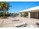 The Summerwoods Community Center features a covered seating area, chaise lounges, palm trees and lush landscaping at 8918 Waxwing Way, Parrish, FL 34219